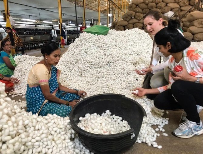 Anjani Nayak and Fabiola Neitzel visit a silk reeling factory during their trip to India (Credit: Team SWAP).